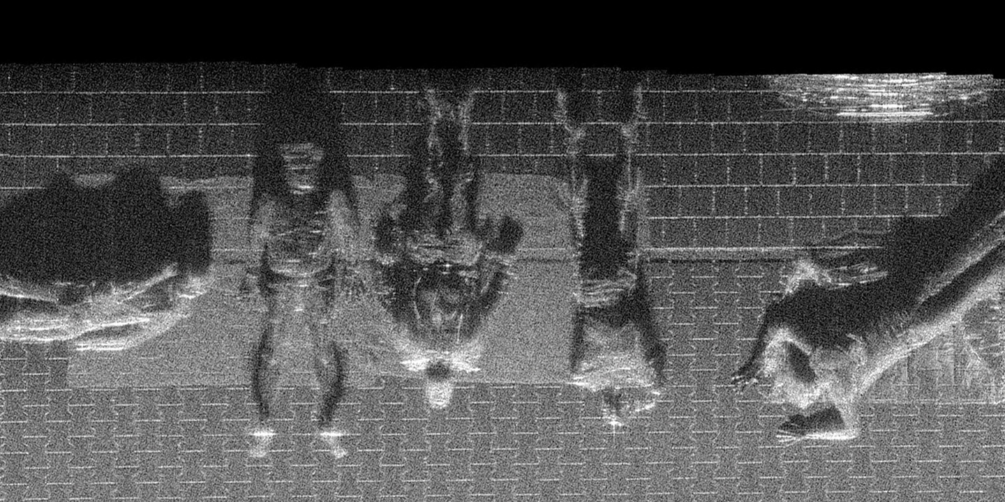 300-GHz SAR image of persons lying at the side of the  street.